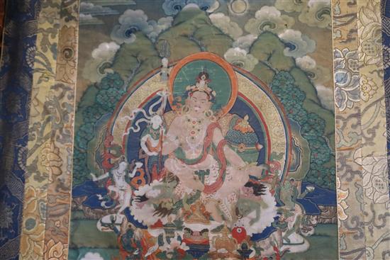 A thangka depicting Padmasambhava in the form of Nyima Ozer, Tibet, 19th century Total dimensions 133cm x 86cm